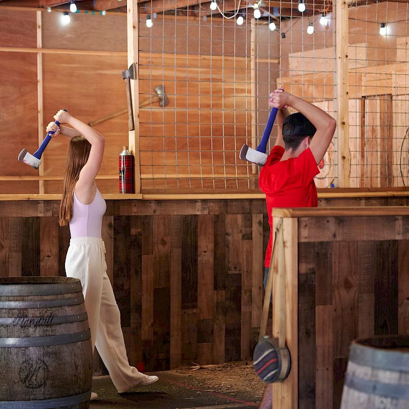 Guests enjoying axe throwing at Skamania Lodge