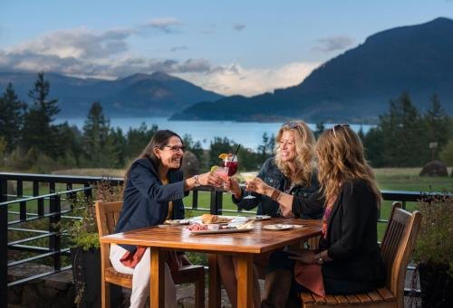 Friends enjoying a meal and drinks on the terrace overlooking the Gorge