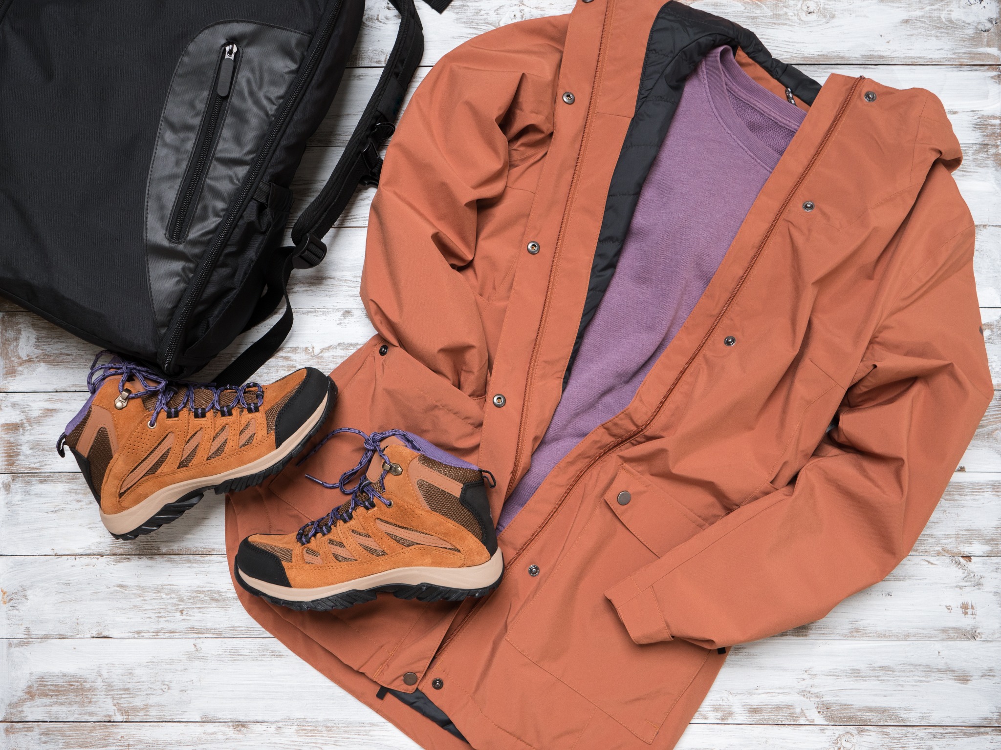 Cozy layers, hiking shoes, and a jacket ready for a fall getaway