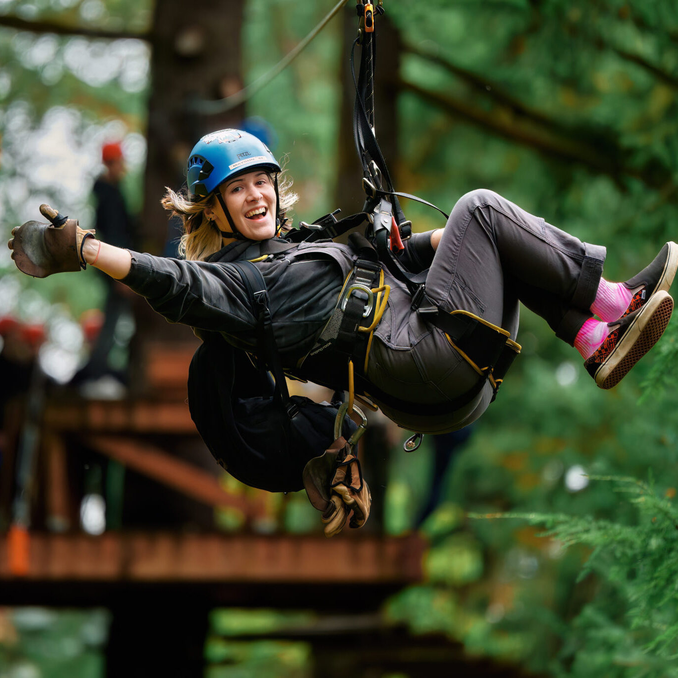 Guest smiling on a zip line at Skamania Lodge